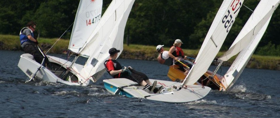 Lasers and GP14s race together in a menagerie race
