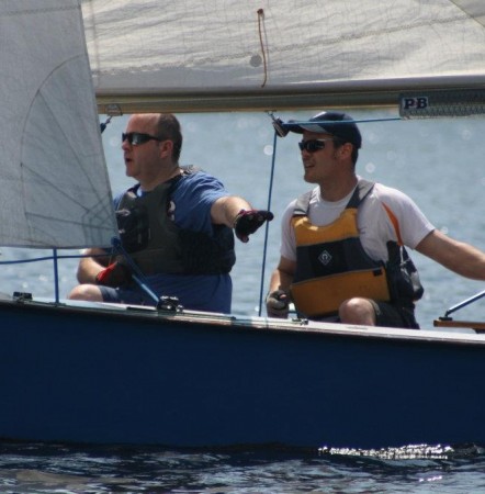 A crew gives directions to a new helm